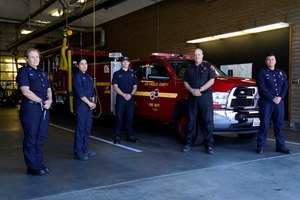 From left, fire Truck Captain Jeane Barrett, firefighter paramedic Sally Ortega, engine probationary firefighter Cole Gomoll, Battalion Chief Dean Douty, and Engine Captain Joe Peña, all first responders from Los Angeles County Fire Department - Station 106, pose for a photo at their station Friday, Feb. 26, 2021. The crew responded to the scene of a vehicle crash involving golfer Tiger Woods on Tuesday.
