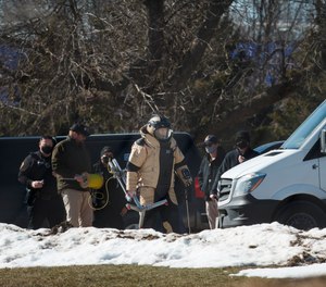 Ankeny Police investigate the scene at the Lakeside Center where a suspicious package was found on Tuesday, March 2, 2021, in Ankeny, Iowa.