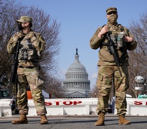 National Guard keep watch on the Capitol, Thursday, March 4, 2021, on Capitol Hill in Washington.