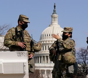 National Guard stand guard at the Capitol in Washington, Thursday, March 4, 2021.