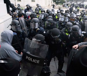 In this Jan. 6, 2021, file photo, U.S. Capitol Police push back rioters trying to enter the U.S. Capitol in Washington.