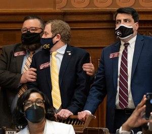 Rep. Heath Clark (R-Warner Robins), left, congratulates Rep. Bert Reeves (R-Marietta) following the passage of HB 479, which would reform citizen arrest laws, Monday evening, March 8, 2021.