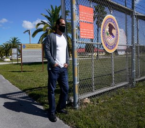Kareen Troitino stands outside the Federal Corrections Institution in Miami.