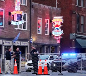 In this Dec. 28, 2020 file photo, police block off a part of the Broadway tourist district as a result of a bombing that took place on Christmas Day in Nashville, Tenn.
