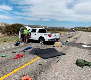 Debris is strewn across a road near the border city of Del Rio, Texas after a collision Monday, March 15, 2021.