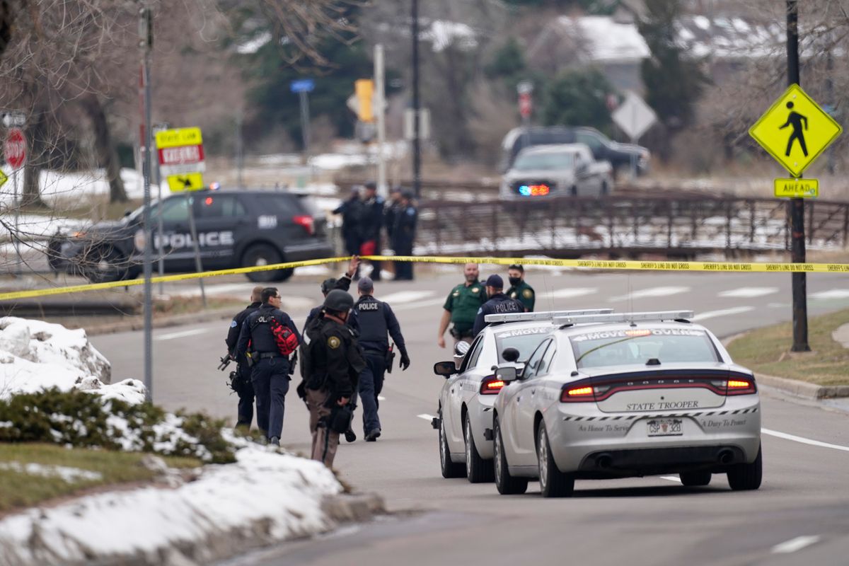 Police work on the scene near a King Soopers grocery store where a shooting took place Monday, March 22, 2021, in Boulder, Colo.