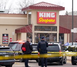 Police stand outside a King Soopers grocery store where a shooting took place, Monday, March 22, 2021, in Boulder, Colo. (AP Photo/David Zalubowski)