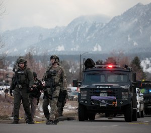 Police work on the scene outside of a King Soopers grocery store where a shooting took place Monday, March 22, 2021, in Boulder, Colo.