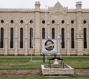Flags are flown at half staff in memory of the two prison workers killed in an escape attempt at the Anamosa State Penitentiary in Anamosa, Iowa.