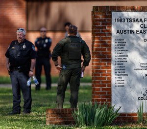 Knoxville police work the scene of a shooting at Austin-East Magnet High School Monday, April 12, 2021, in Knoxville, Tenn.
