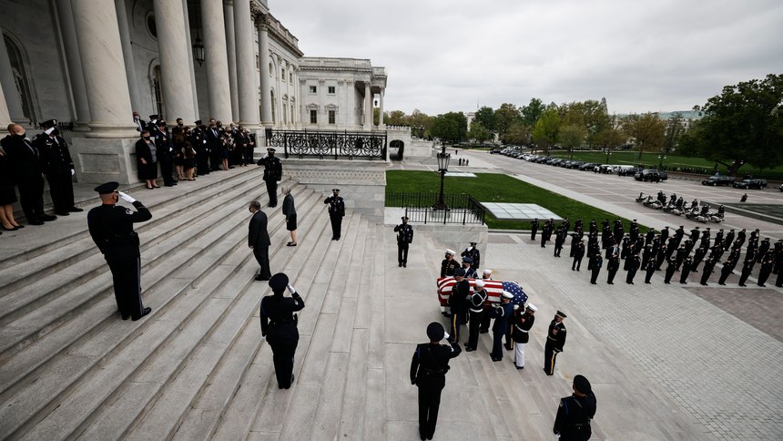 An honor guard carries the flag-draped casket of slain U.S. Capitol Police officer William “Billy” Evans up the Capitol steps to the Capitol rotunda where he will lie in honor Tuesday, April 13, 2021 in Washington.