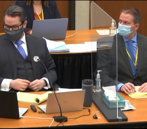 In this image from video, defense attorney Eric Nelson, left, and former Minneapolis police officer Derek Chauvin listen, Wednesday, April 14, 2021, at the trial of Chauvin in Minneapolis.