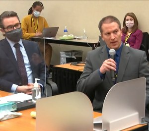 In this image from video, defense attorney Eric Nelson, left, and defendant, former Minneapolis police officer Derek Chauvin address Hennepin County Judge Peter Cahill during motions before the court Thursday, April 15, 2021, in the trial of Chauvin, at the Hennepin County Courthouse in Minneapolis.
