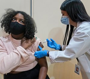 Keidy Ventura, 17, got her first dose of the Pfizer COVID-19 vaccine in West New York, N.J., on April 19.