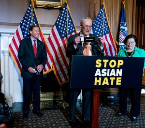 Senate Majority Leader Chuck Schumer of N.Y., accompanied by Sen. Mazie Hirono, D-Hawaii, Sen. Tammy Duckworth, D-Ill., and Sen. Richard Blumenthal, D-Conn., speaks at a news conference after the Senate passed a COVID-19 Hate Crimes Act on Capitol Hill, Thursday, April 22, 2021, in Washington.