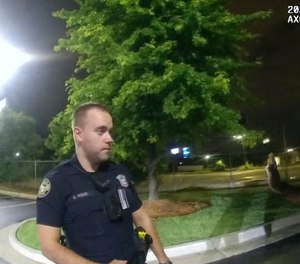 In this June 12, 2020, file photo from a screen grab taken from body camera video provided by the Atlanta Police Department Rayshard Brooks, right, speaks with Officer Garrett Rolfe, left, in the parking lot of a Wendy's restaurant, in Atlanta.