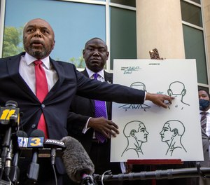 Attorneys for the family of Andrew Brown Jr., Wayne Kendall, left, and Ben Crump hold a news conference Tuesday, April 27, 2021 outside the Pasquotank County Public safety building in Elizabeth City, N.C., to announce results of the autopsy they commissioned.