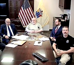 Richard Cottingham, center, known as the