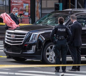 Los Angeles Police Department investigates the scene of a drive-by shooting at 7th and Figueroa Streets where an Uber driver was shot and killed Tuesday, April 27, 2021, in downtown Los Angeles.