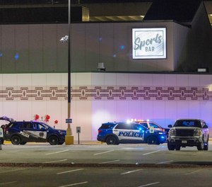 Police line the parking lot outside the Oneida Casino in the early morning hours of Sunday, May 2nd, 2021, near Green Bay, Wisconsin.