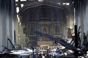 In this file photo, the interior of the San Gabriel Mission is seen in the aftermath of a 2020 fire in San Gabriel, Calif. A suspect in the fire, John David Corey, was ordered in December to stand trial.