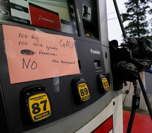 This photo shows a sign at a gas pump in Charlotte, N.C., showing the station is out of all grades of fuel after the shutdown of a major pipeline last week. Emergency services officials in Greene County, N.C., say they have had to make some changes in order to conserve fuel amid the shortage.
