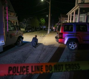 Providence police say several dozen shots were fired at a home on Thursday night, leaving nine people wounded. Three of the patients were seriously injured.