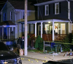 Providence Police investigate a shooting on Carolina Avenue, late Thursday, May 13, 2021, in Providence, R.I.