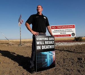 Aaron McGlothin, union president at the Federal Correctional Institution at Mendota, poses for a photo while leading a protest against staffing shortages, near the prison entrance in Mendota, Calif., Monday, May 17, 2021.