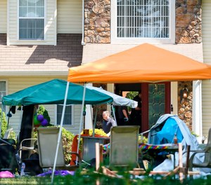 Investigators works the scene of a shooting in Fairfield Township, N.J., Sunday, May 23, 2021.