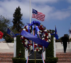 An alternate smaller American flag flies over the Los Angeles National Cemetery in Los Angeles, Monday, May 31, 2021.