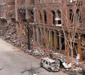 In this Dec. 29, 2020 file photo, a vehicle destroyed in a Christmas Day explosion remains on the street in Nashville, Tenn.