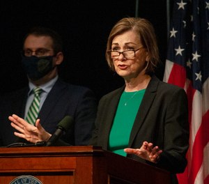 In this March 17, 2021 file photo, Gov. Kim Reynolds speaks during a news conference in a suburb of Des Moines, Iowa.