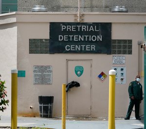 A corrections officer stands near a door at the Miami-Dade County Pre-Trial Detention Center, Friday, June 4, 2021, in Miami.