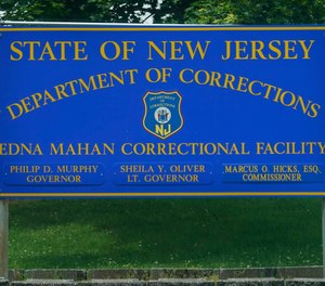 A sign is displayed at the entrance to the Edna Mahan Correctional Facility for Women in Clinton, N.J., Tuesday, June 8, 2021.