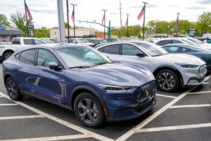A pair of 2021 Ford Mustang Mach-E vehicles were for sale at a Ford dealer on May 6, 2021, in Wexford, Pa. Broeder de Vries's Mach-E has been customized and is being put through tests.