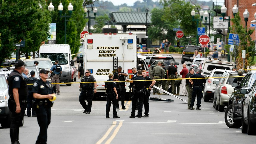Police officers investigate the scene of an early afternoon shooting in Olde Town Arvada on Monday, June 21, 2021 in Arvada, Colo.