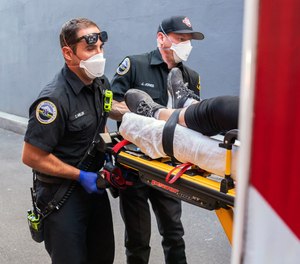 Paramedics Cody Miller, left, and Justin Jones respond to a heat exposure call during a heat wave, Saturday, June 26, 2021, in Salem, Ore.