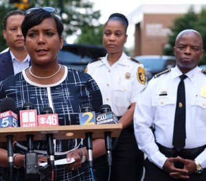 Atlanta Mayor Keisha Lance Bottoms, left, with Atlanta Police Chief Rodney Bryant, said two officers were