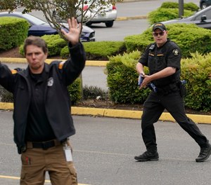 Andrew Thomas, right, of the King Co. Sheriff's Dept. takes part in a training exercise at the Washington state Criminal Justice Training Commission, Wednesday, July 14, 2021, in Burien, Wash. Washington state is embarking on a massive experiment in police reform and accountability following the protests that erupted after the death of George Floyd, with nearly a dozen new laws that took effect Sunday, July 25, but law enforcement officials remain uncertain about what they require in how officers might respond — or not respond — to certain situations, including active crime scenes and mental health crises.