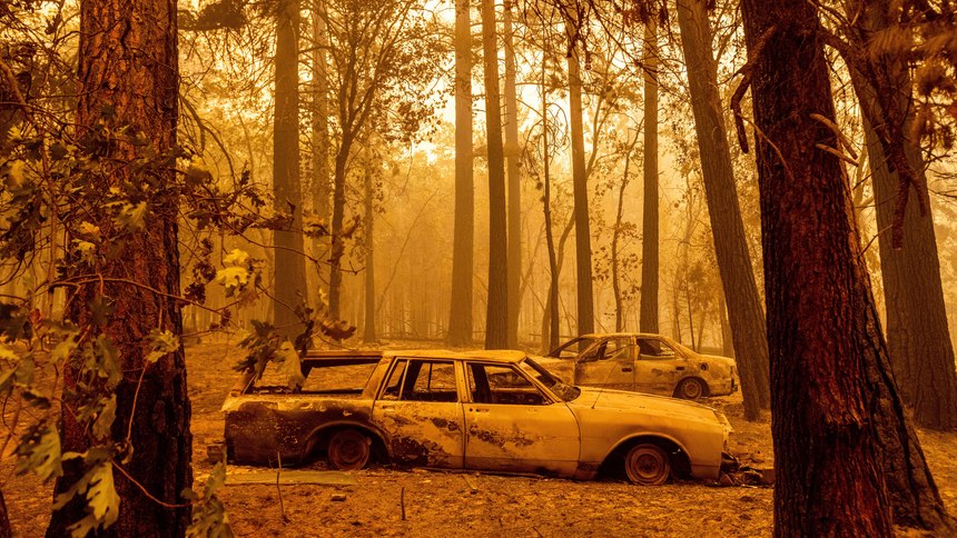 Following the Dixie Fire, scorched cars are seen in a clearing in the Indian Falls community of Plumas County, Calif., on Sunday, July 25, 2021.