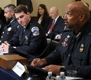 U.S. Capitol Police Sgt. Aquilino Gonell, from left, Washington Metropolitan Police Department officer Michael Fanone, Washington Metropolitan Police Department officer Daniel Hodges and U.S. Capitol Police Sgt. Harry Dunn testify before the House select committee hearing on the Jan. 6 attack on Capitol Hill in Washington, Tuesday, July 27, 2021.