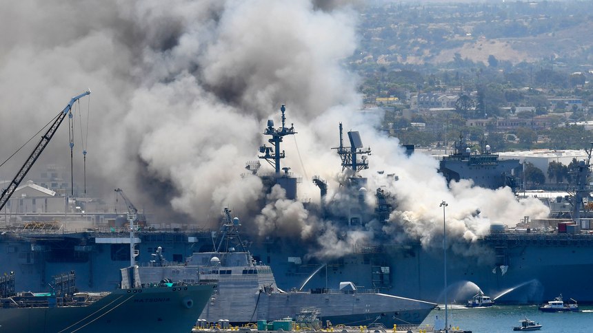 Smoke rises from the USS Bonhomme Richard after an explosion and fire onboard the ship at Naval Base San Diego in July 2020.