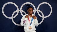 Simone Biles says she was once ticketed by an officer who was later an Olympic escort
