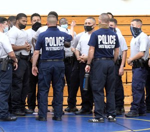 Baltimore city police instructors speak to police trainees during defense tactic training, Wednesday, Aug. 4, 2021, in Baltimore.