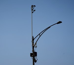 In this Aug. 10, 2021, file photo, ShotSpotter equipment overlooks the intersection of South Stony Island Avenue and East 63rd Street in Chicago.