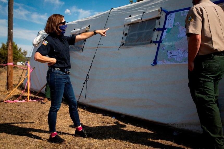 Oregon Gov. Kate Brown, left, visits the Bly Fire Camp, on the southern edge of the Bootleg Fire, in Klamath County, Ore.