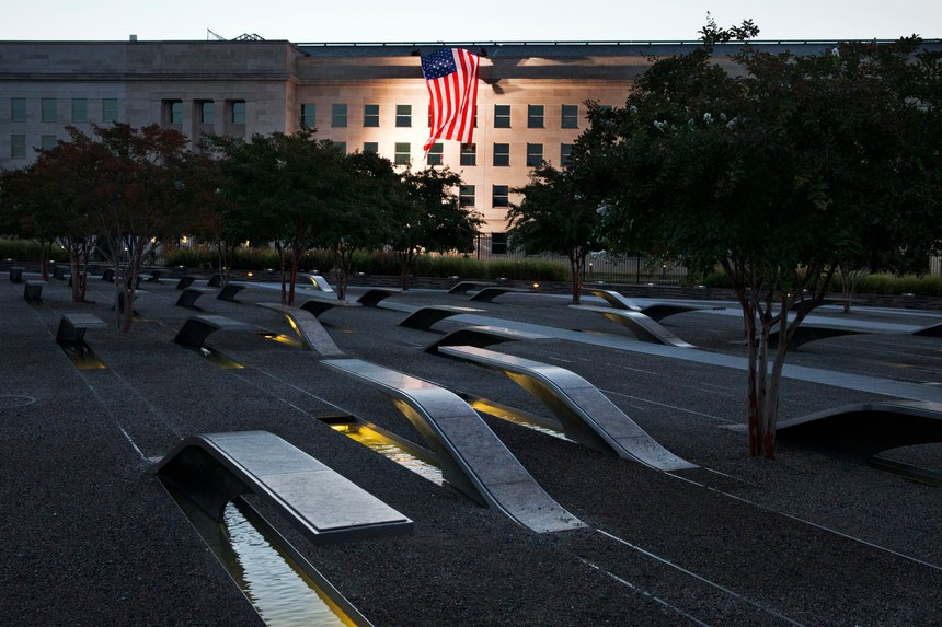 A U.S. flag is draped on the side of the Pentagon where the attack took place, seen from the Pentagon Memorial.