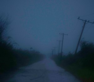 A utility pole bends from winds caused by Hurricane Ida on a road leading to Batabano, in the Mayabeque province, Cuba, Friday, Aug. 27, 2021.