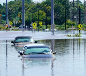 Vehicles are under water during flooding in Norristown, Pa. Thursday, Sept. 2, 2021 in the aftermath of downpours and high winds from the remnants of Hurricane Ida that hit the area.
